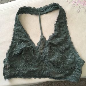 Victoria's Secret Olive Green Bralette over head.